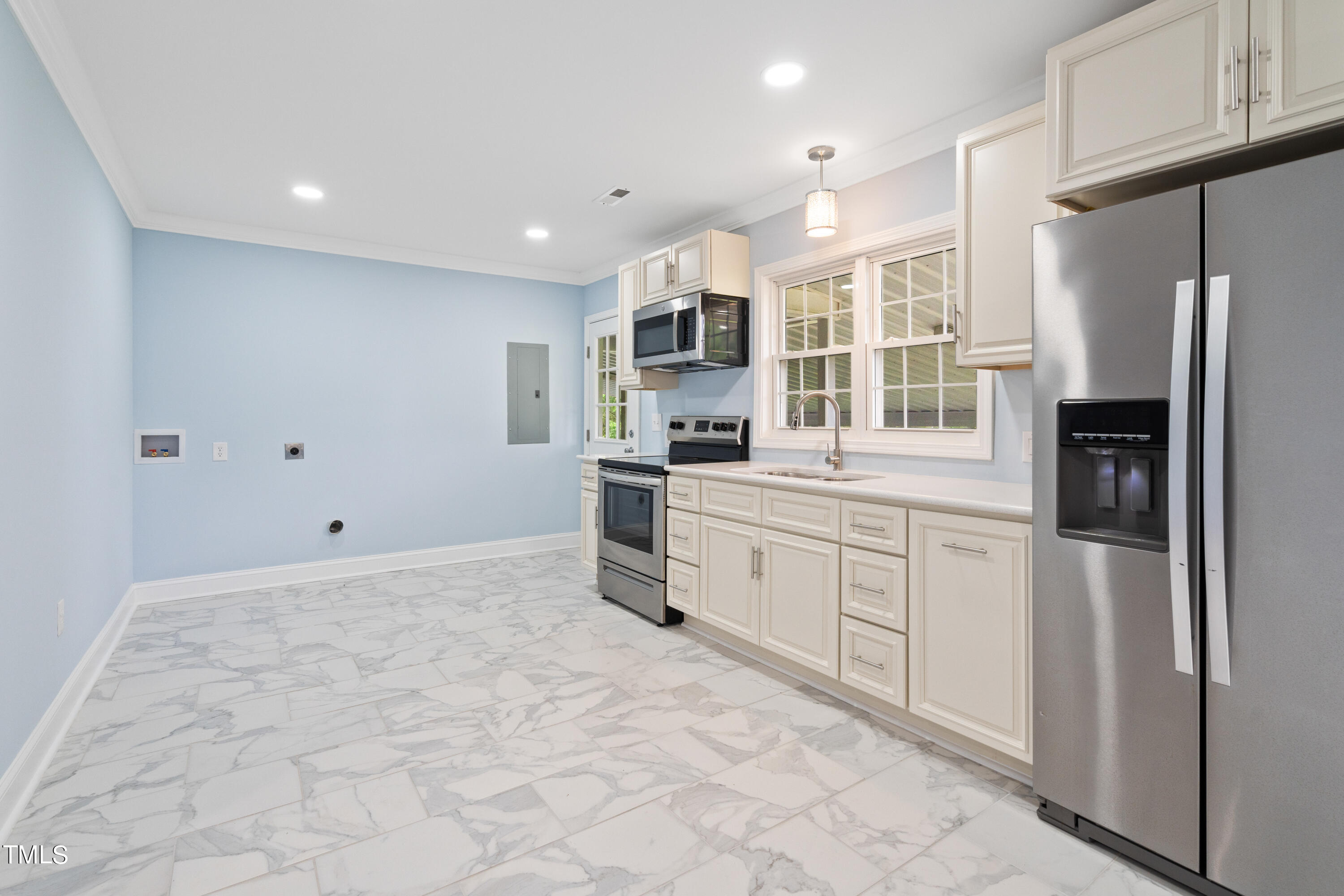 244 Semora Road Roxboro, NC 27573 - Photo 8 of 42 a kitchen with granite countertop a refrigerator and white cabinets