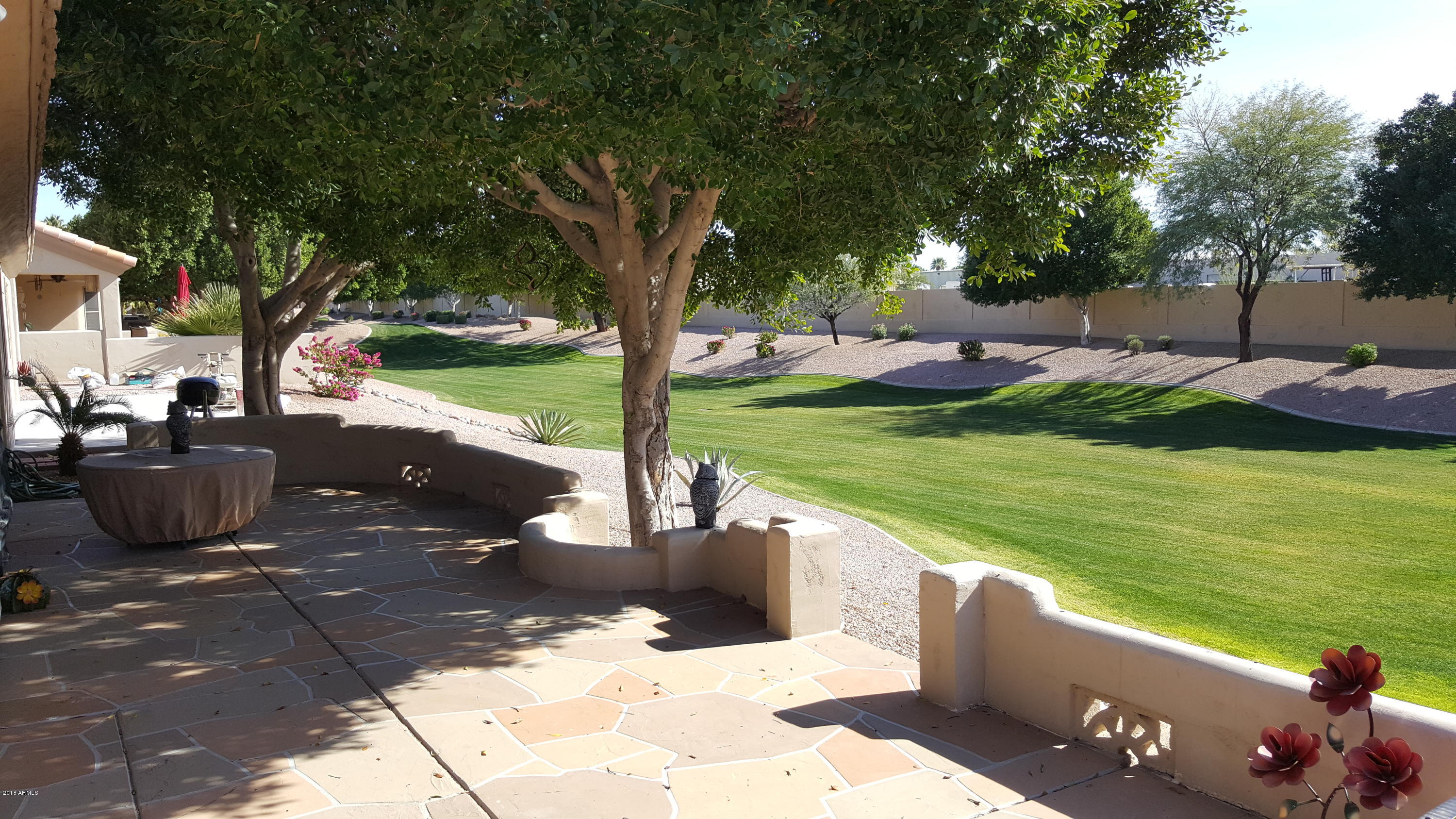 5830 East McKellips Road, Unit 75 Mesa, AZ 85215 - Photo 11 of 30 a view of a garden with sitting area