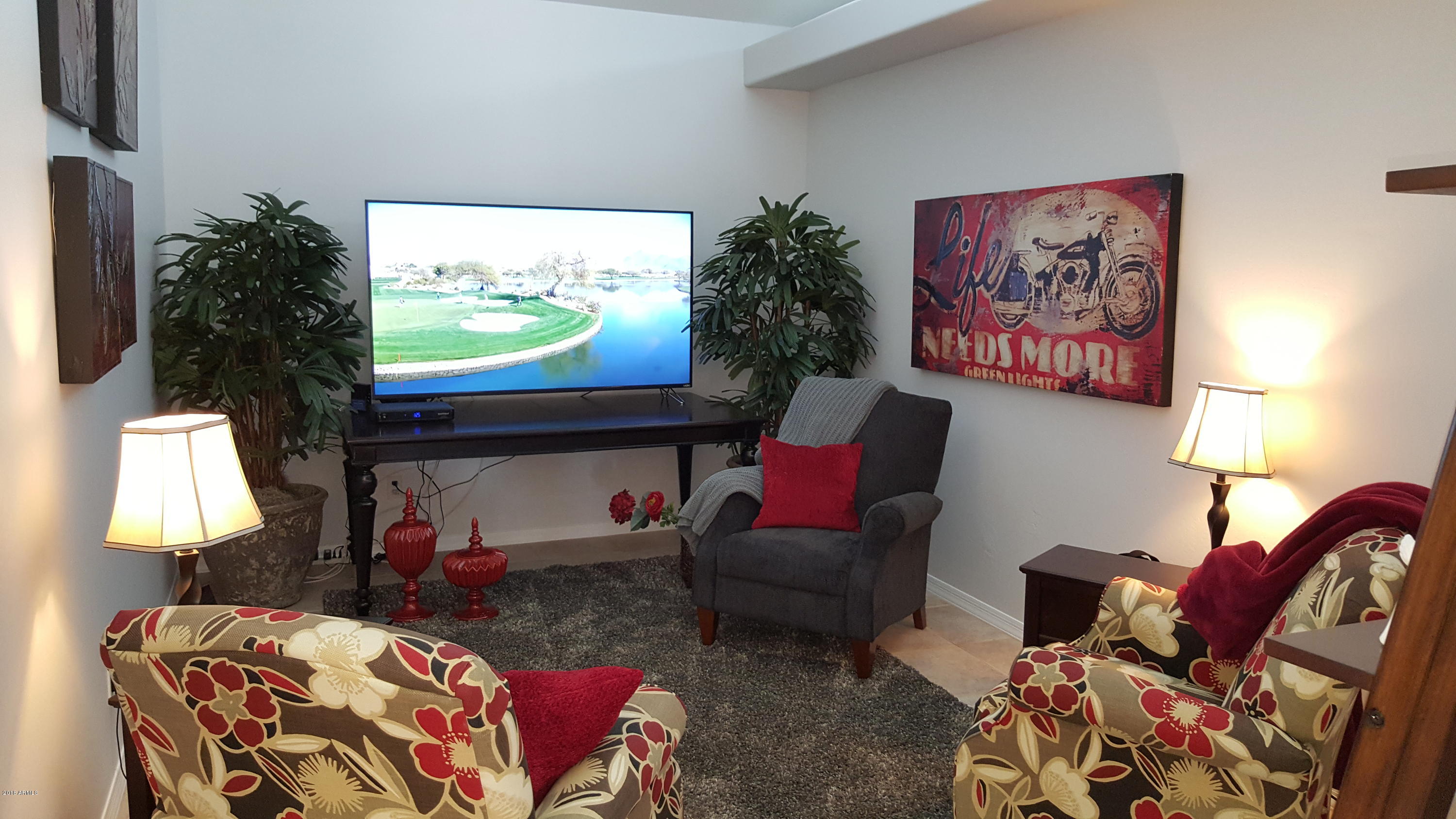 5830 East McKellips Road, Unit 75 Mesa, AZ 85215 - Photo 19 of 30 a living room with furniture and a flat screen tv