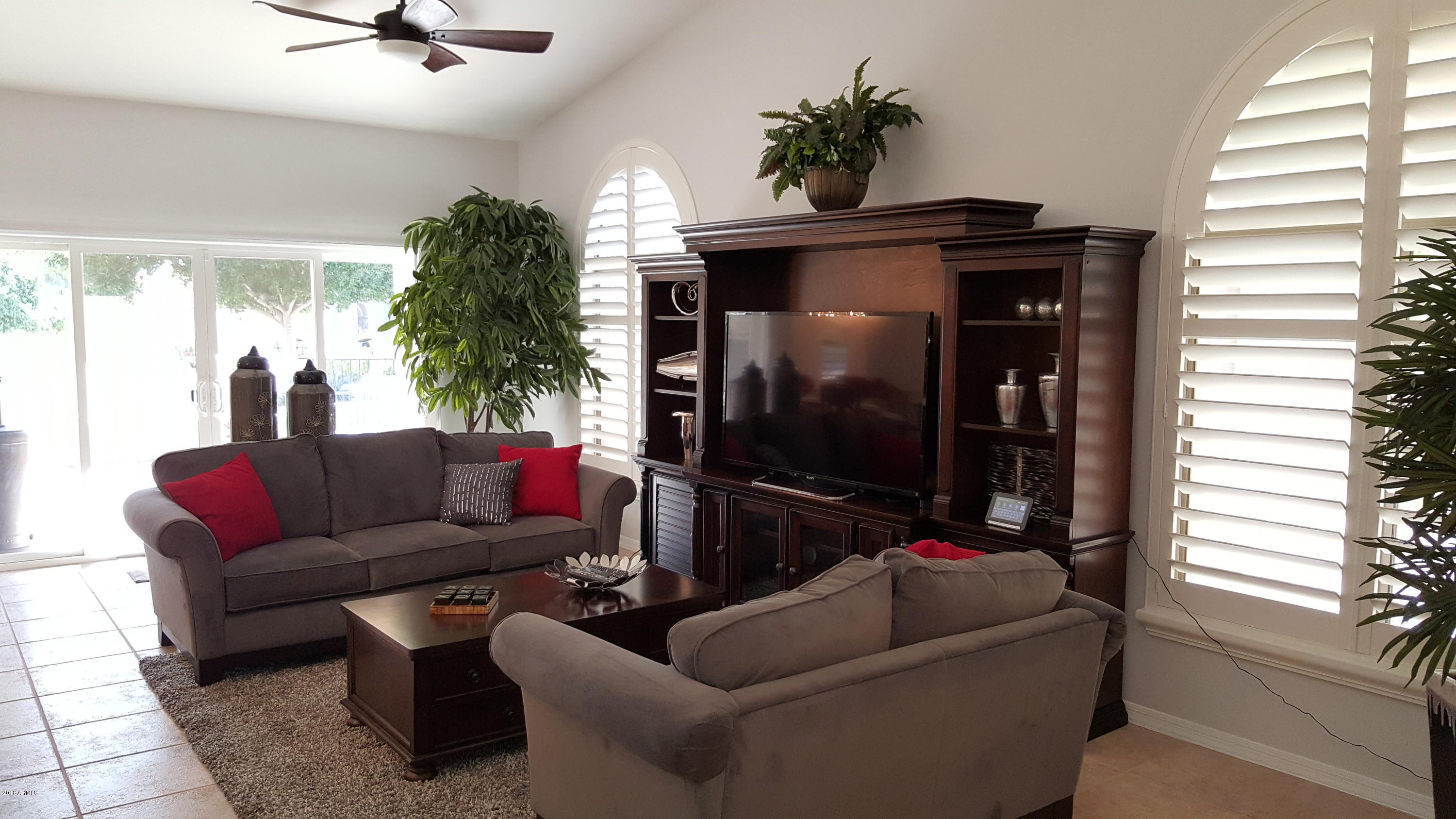 5830 East McKellips Road, Unit 75 Mesa, AZ 85215 - Photo 4 of 30 a living room with furniture and a flat screen tv