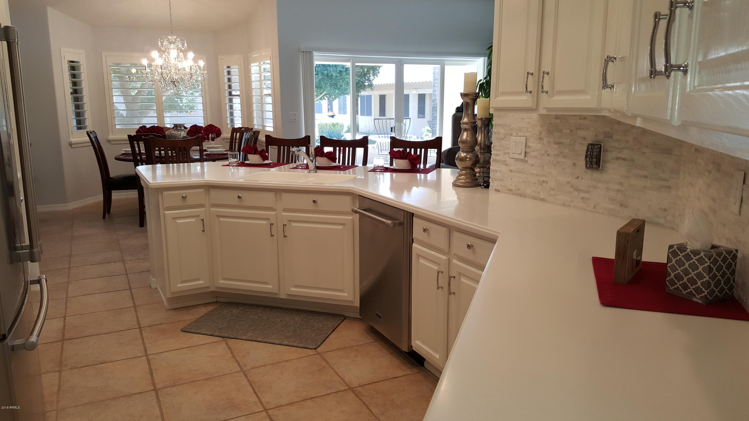 5830 East McKellips Road, Unit 75 Mesa, AZ 85215 - Photo 7 of 30 a kitchen with stainless steel appliances a sink stove and cabinets