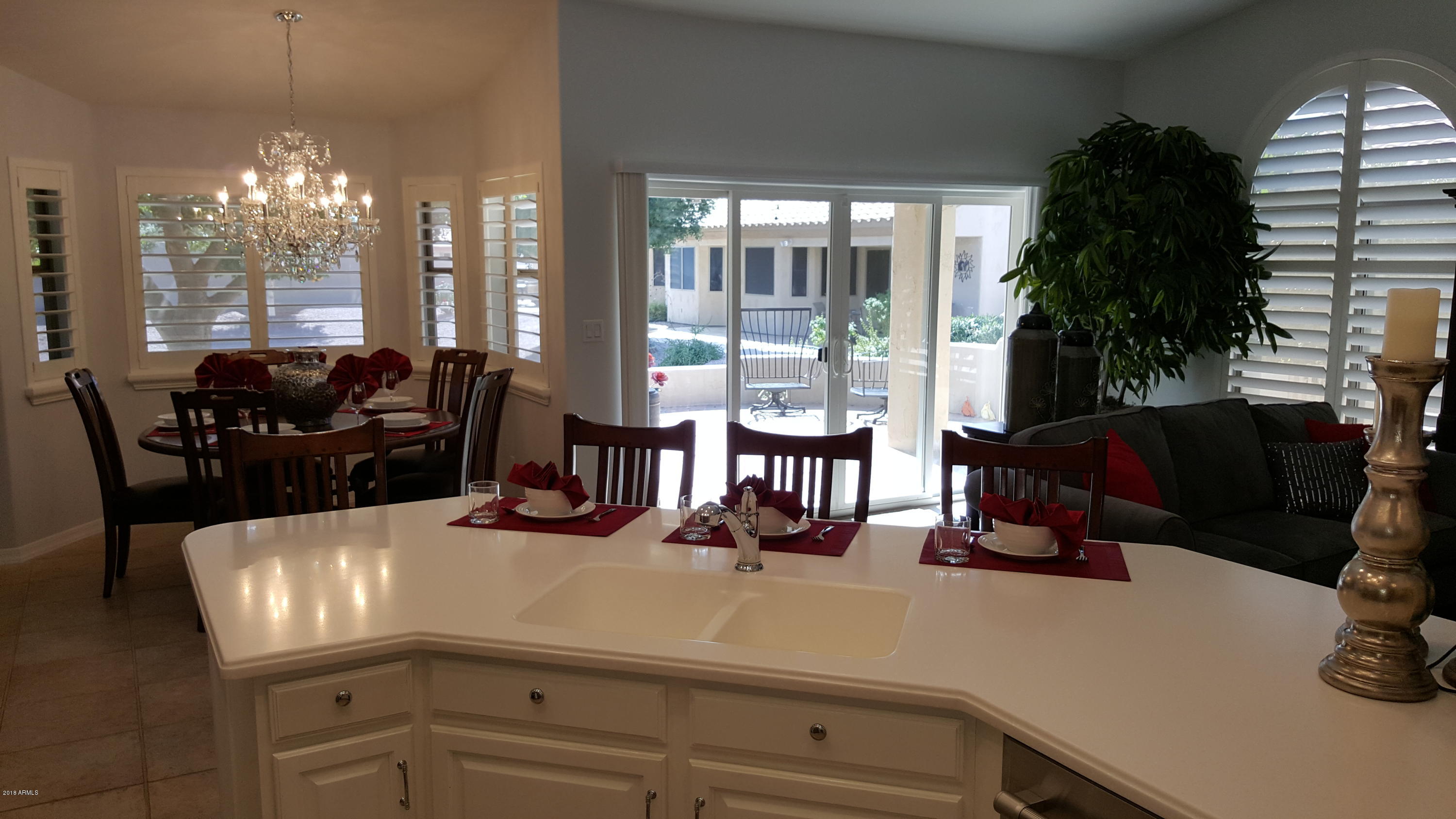 5830 East McKellips Road, Unit 75 Mesa, AZ 85215 - Photo 8 of 30 a kitchen with a refrigerator and a view of living room