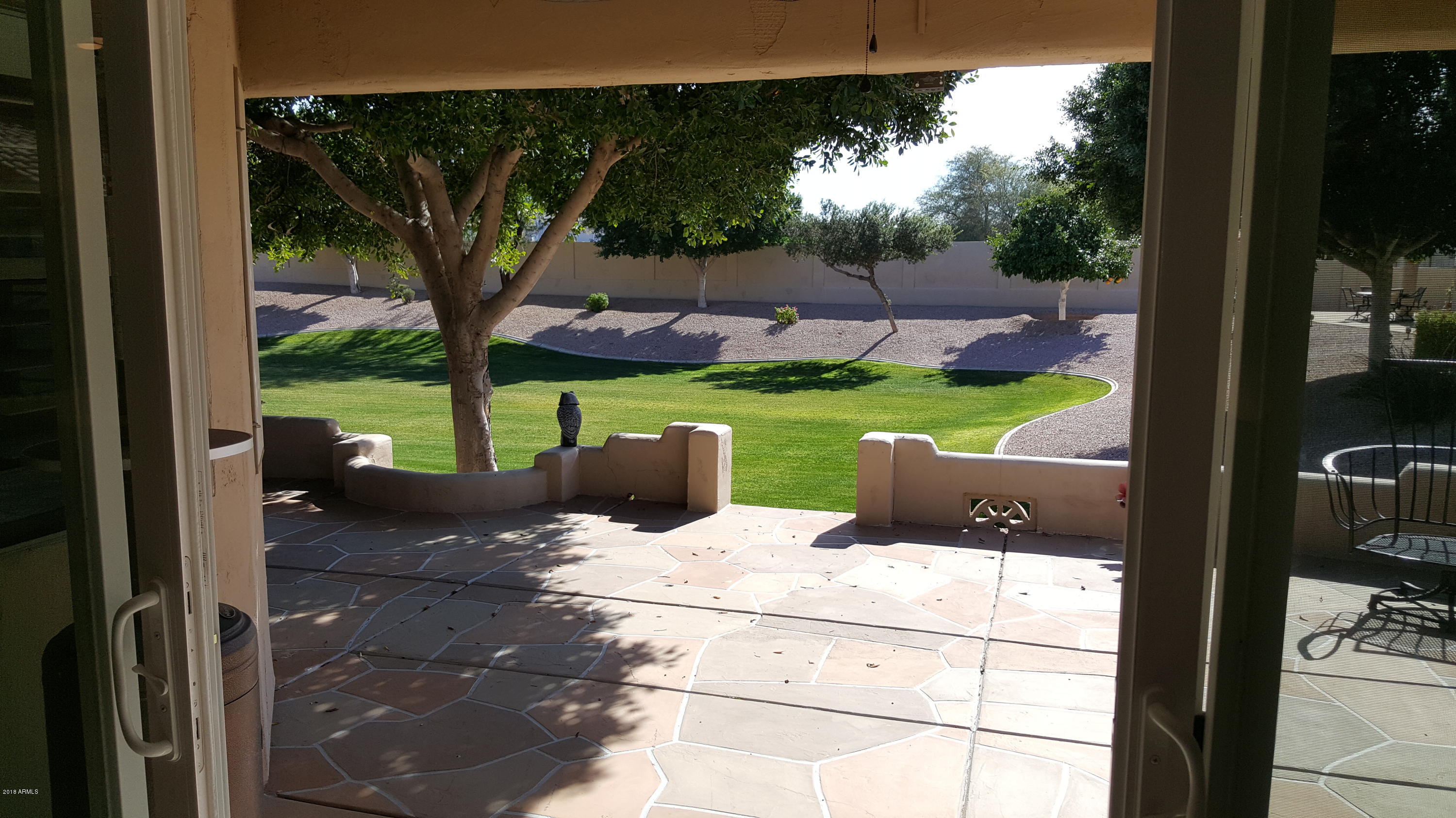 5830 East McKellips Road, Unit 75 Mesa, AZ 85215 - Photo 9 of 30 a view of a backyard with sitting area