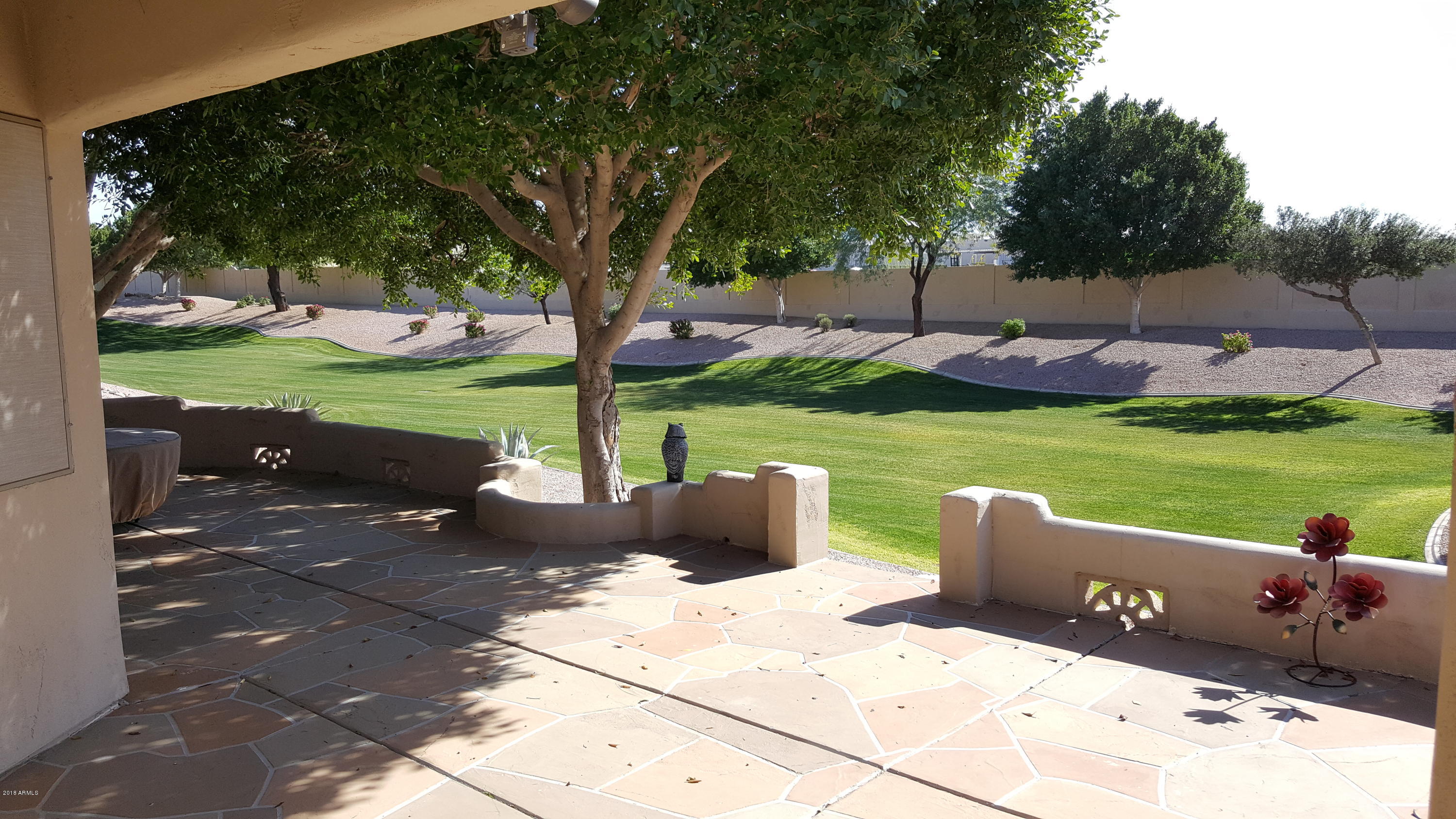 5830 East McKellips Road, Unit 75 Mesa, AZ 85215 - Photo 10 of 30 a view of a garden with patio