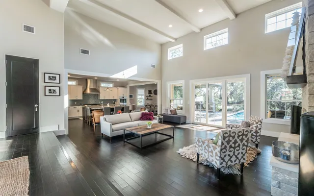 a living room with fireplace furniture and a flat screen tv