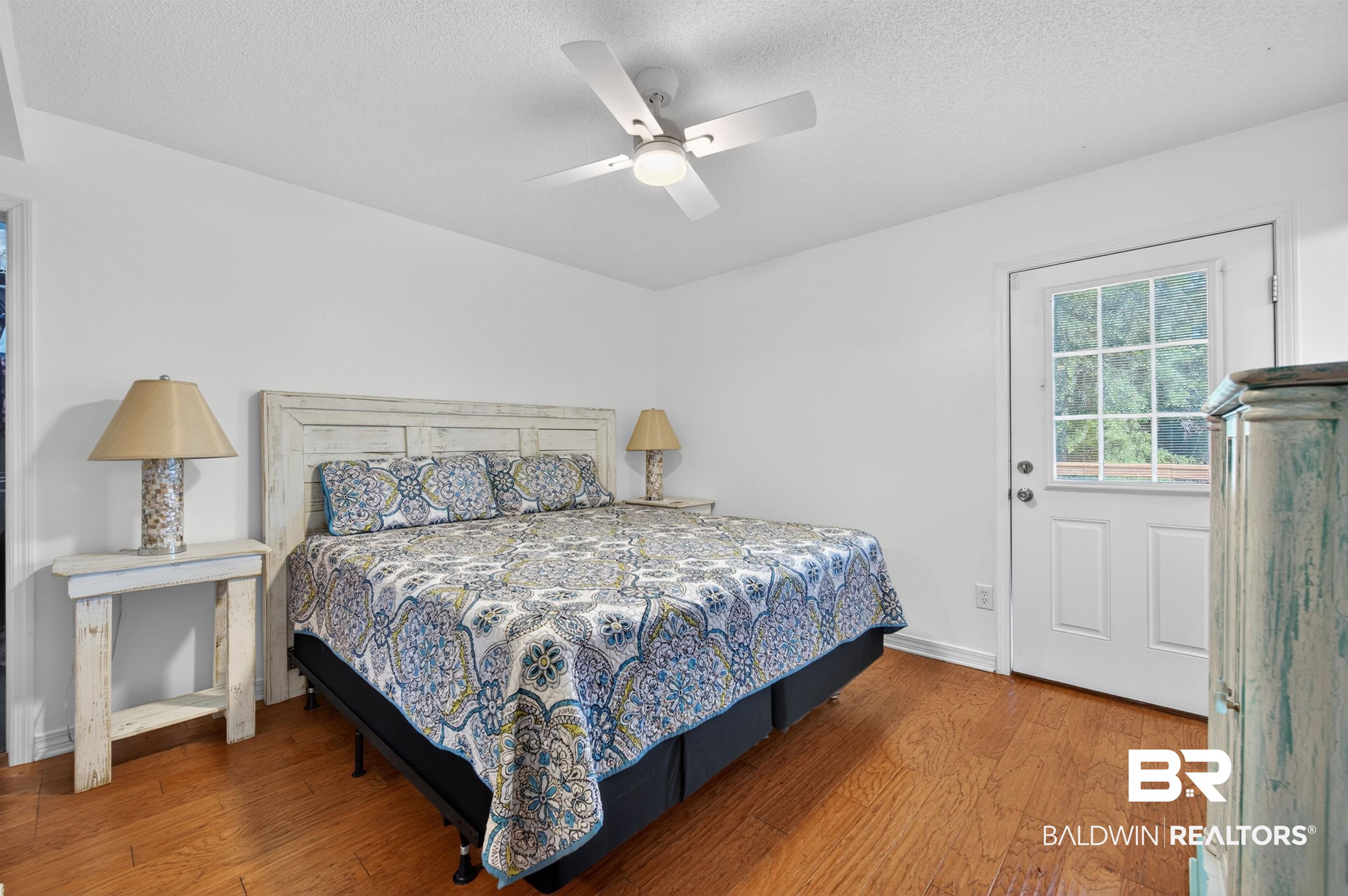 9624 North Bay Street Foley, AL 36535 - Photo 20 of 59 Bright room featuring wood-finish flooring and a ceiling fan