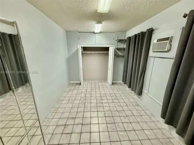 a bathroom with a shower and a mirror