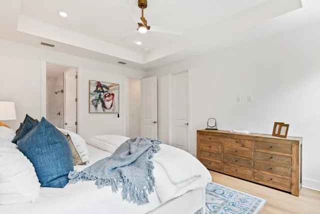 a bedroom with a bed and a dresser