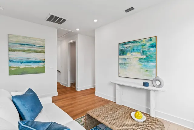 a view of a dining room with furniture and a window