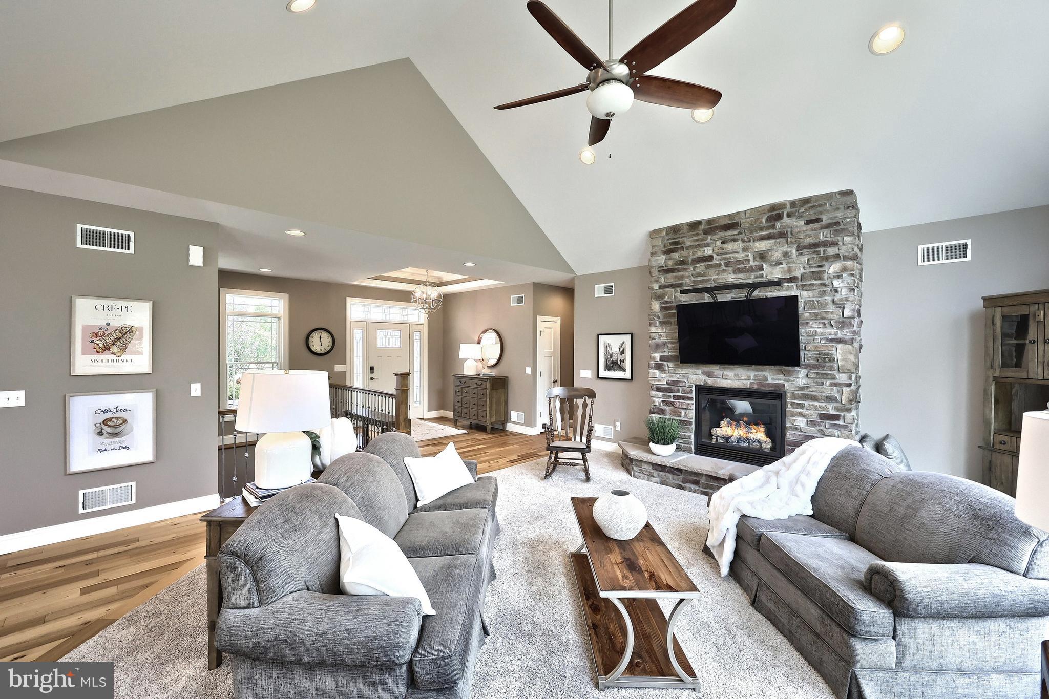 172 Fawn Hill Road Hanover, PA 17331 - Photo 38 of 71 a living room with furniture a flat screen tv and a fireplace