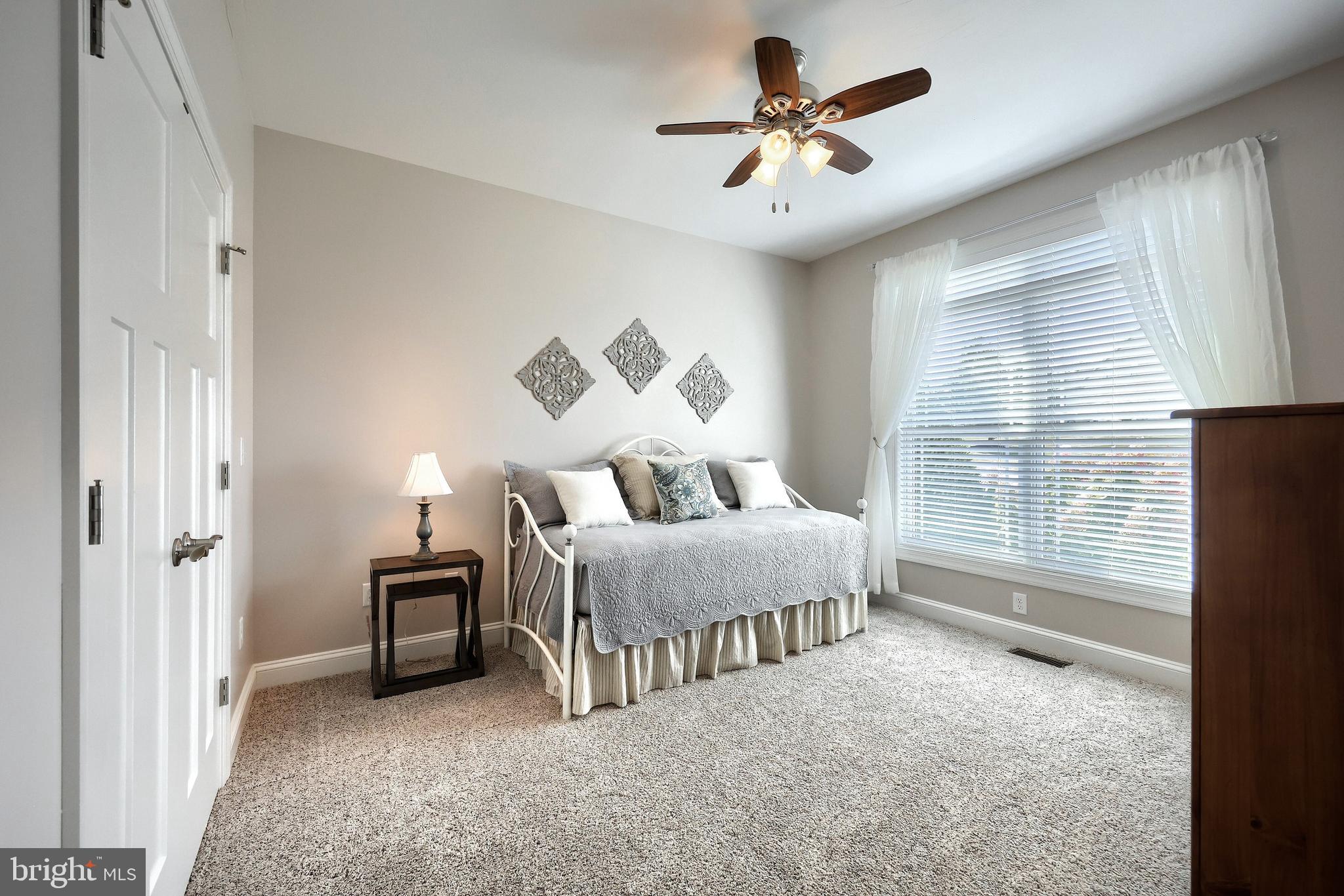 172 Fawn Hill Road Hanover, PA 17331 - Photo 55 of 71 a spacious bedroom with a bed and a chandelier