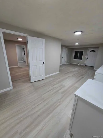 a view of a livingroom with wooden floor
