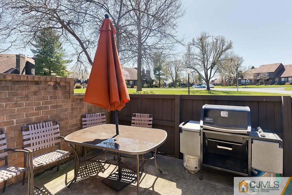 157 Westgate Drive Edison, NJ 08820 - Photo 11 of 12 a view of a two chairs and table in the patio
