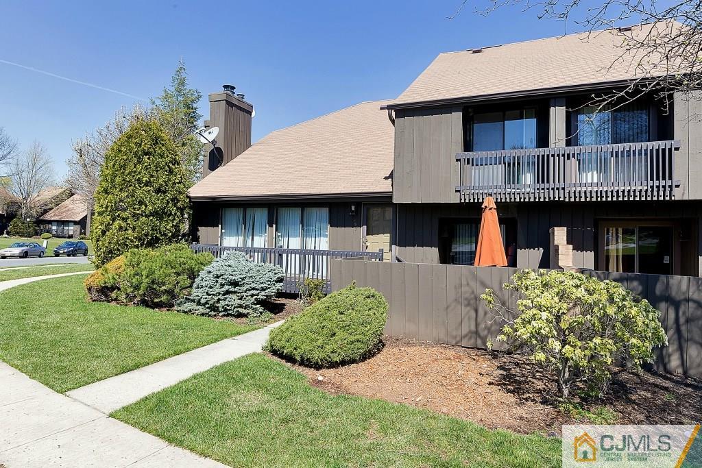 157 Westgate Drive Edison, NJ 08820 - Photo 12 of 12 a front view of a house with garden