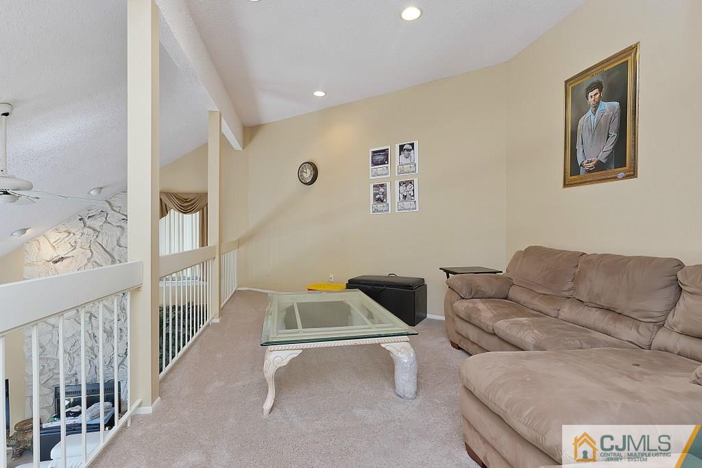 157 Westgate Drive Edison, NJ 08820 - Photo 6 of 12 a living room with furniture and a couch