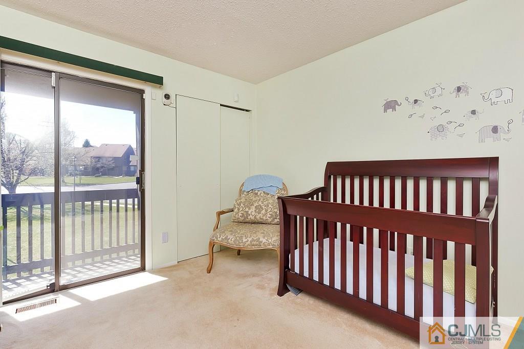 157 Westgate Drive Edison, NJ 08820 - Photo 9 of 12 a bedroom with a bed and a window