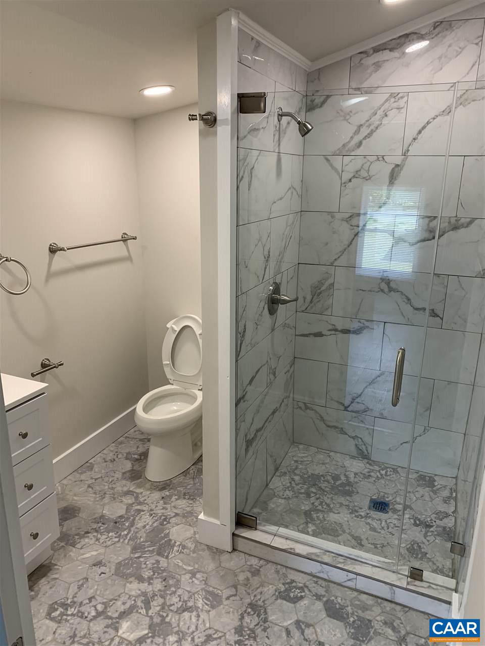 1109 Myrtle Street, Unit B Charlottesville, VA 22902 - Photo 7 of 14 a bathroom with a toilet and shower