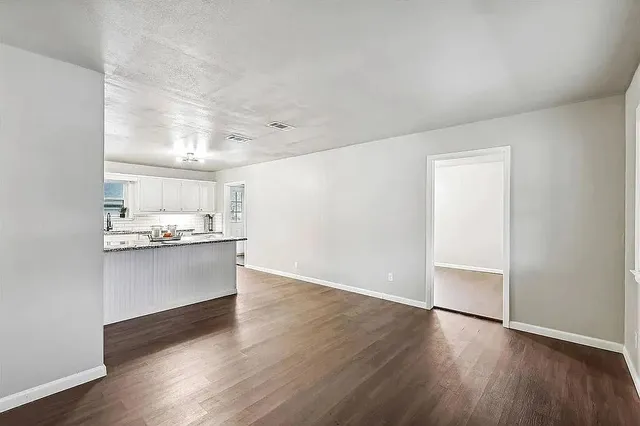 a view of kitchen with wooden floor