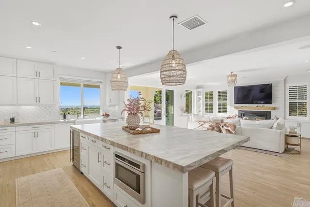 a kitchen with a table and chairs in it