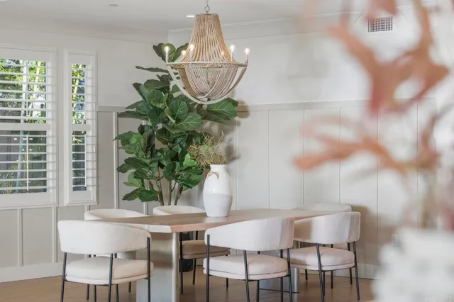 a spacious bathroom with a granite countertop tub a sink and a large window