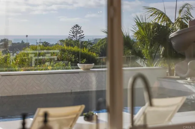 a spacious bathroom with a granite countertop sink and a mirror