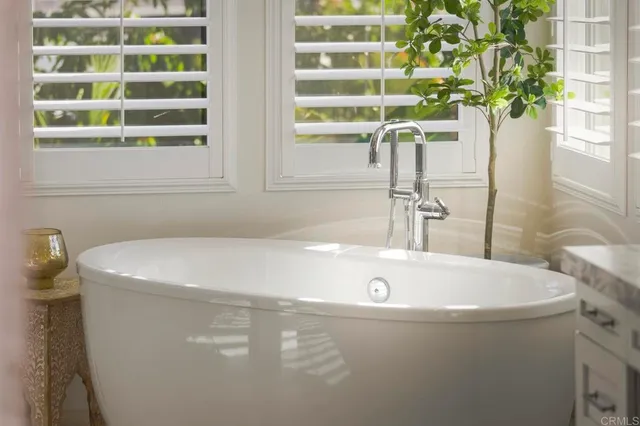 a view of a house with backyard porch and sitting area