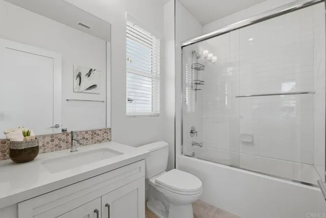 an aerial view of residential houses with city view