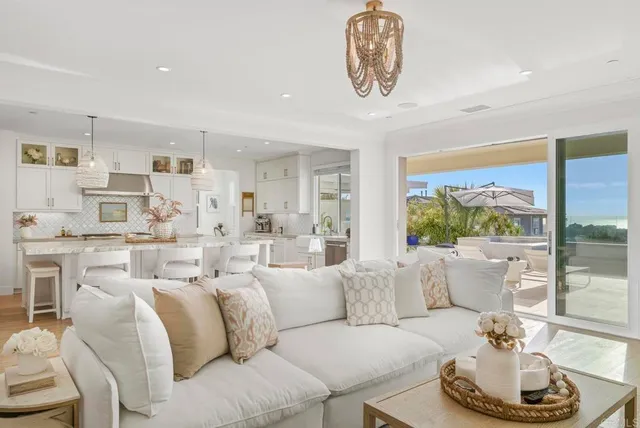 a kitchen with stainless steel appliances granite countertop stove and a wooden floor
