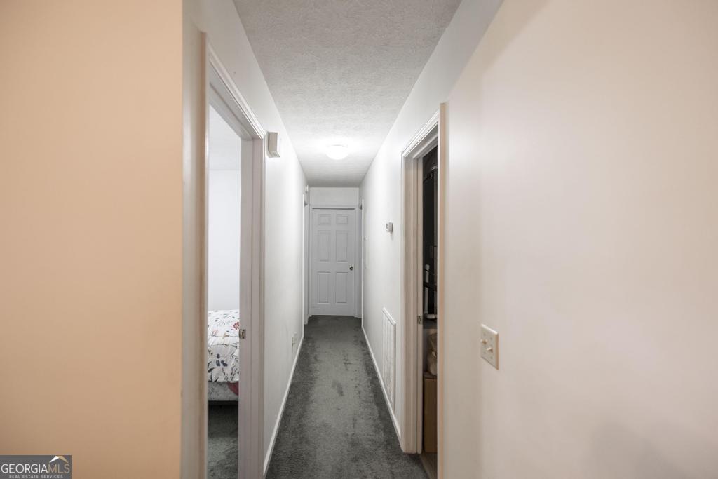 904 Robinhood Road Dublin, GA 31021 - Photo 17 of 29 a view of a hallway with a white walls