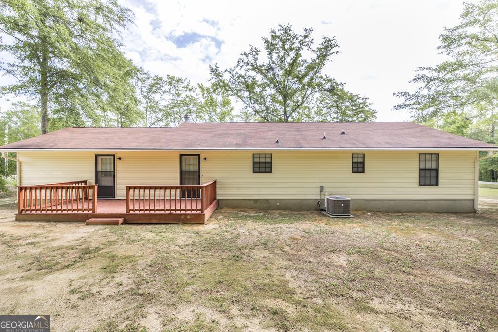 904 Robinhood Road Dublin, GA 31021 - Photo 27 of 29 a view of a house with a backyard and a table