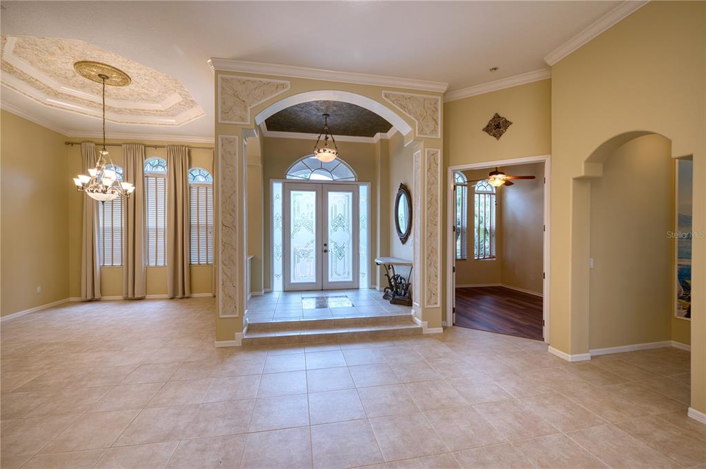 10523 Cheval Place Lakewood Ranch, FL 34202 - Photo 3 of 52 a view of a hallway with wooden shelves