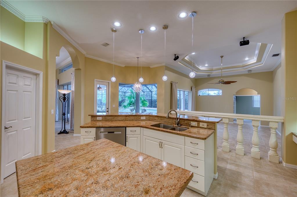 10523 Cheval Place Lakewood Ranch, FL 34202 - Photo 41 of 52 a kitchen with stainless steel appliances granite countertop a sink and cabinets