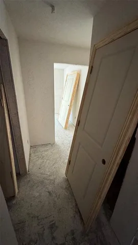 a view of a house with a wooden deck