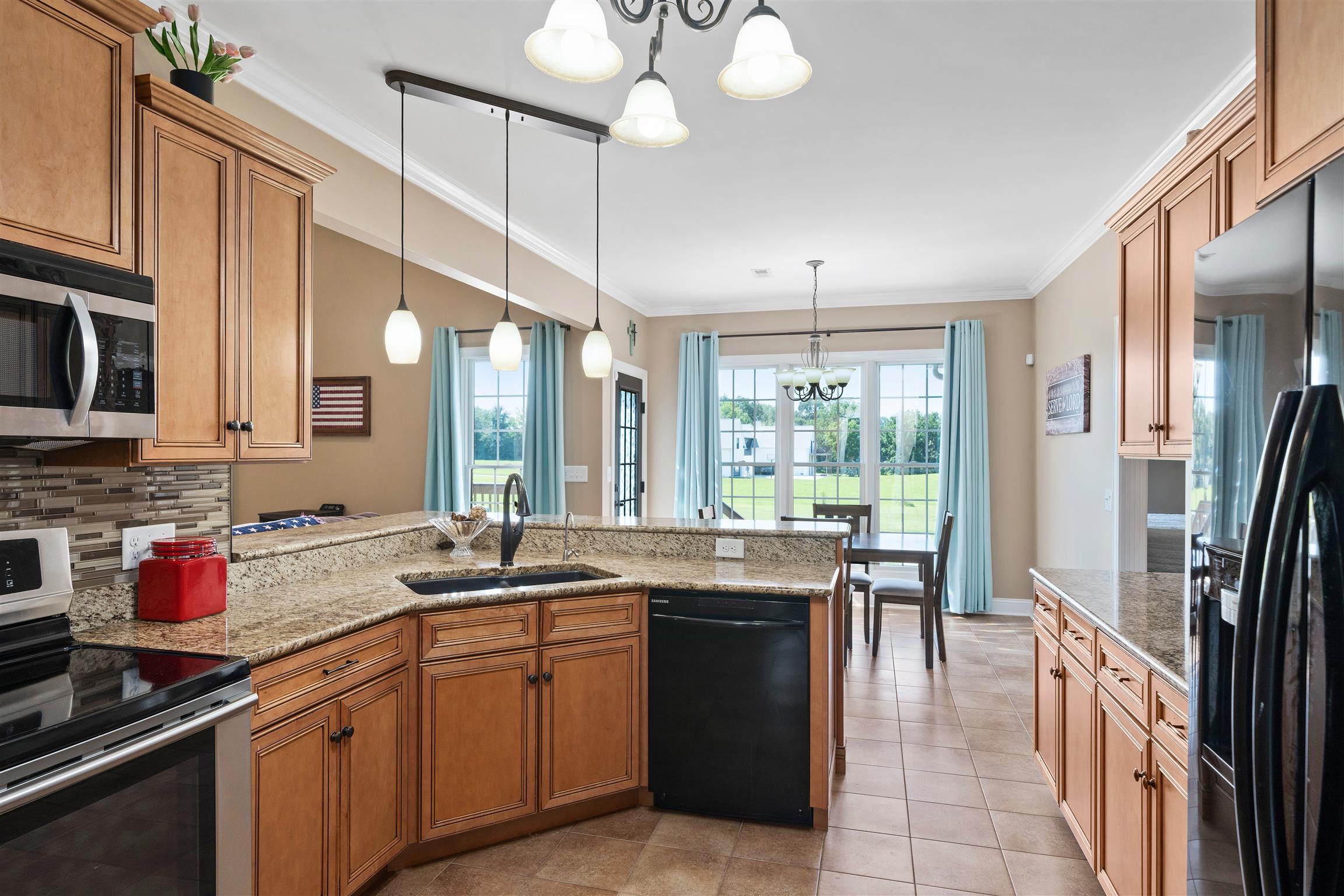 2570 Gunn Road Adams, TN 37010 - Photo 13 of 27 a kitchen with a sink stove and cabinets