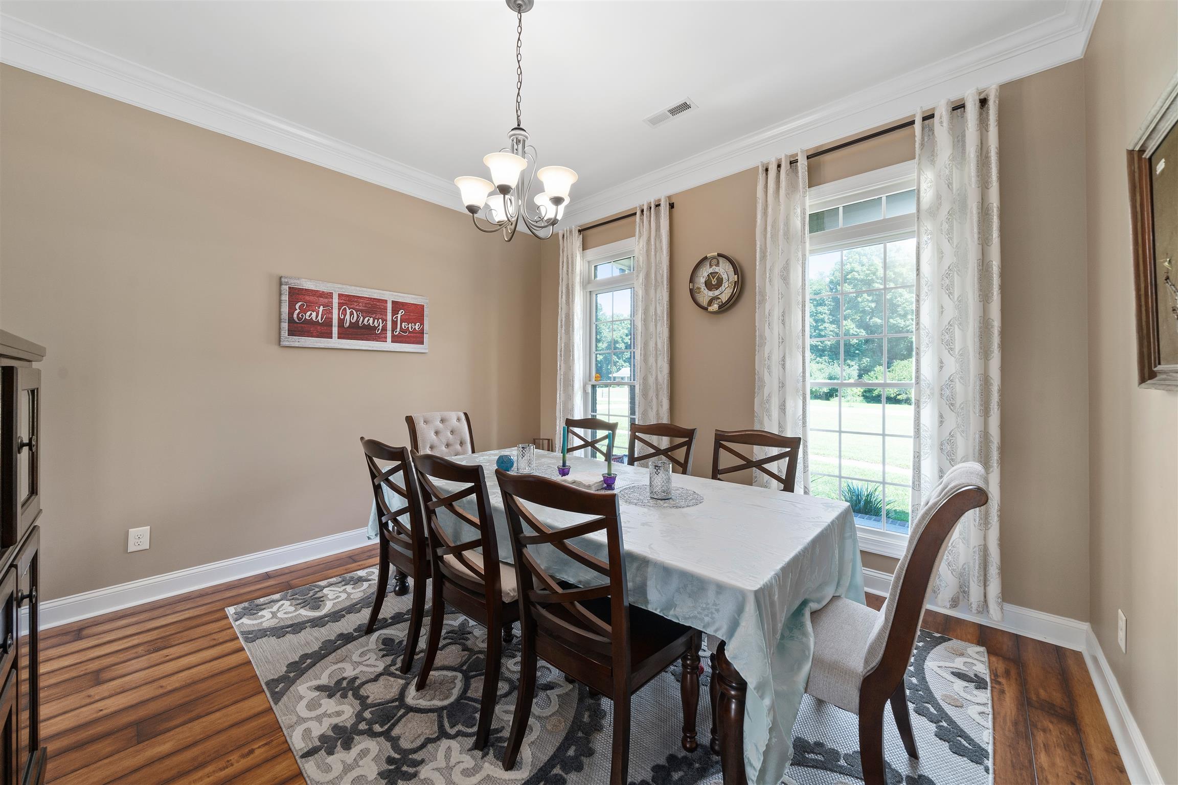 2570 Gunn Road Adams, TN 37010 - Photo 14 of 27 a view of a dining room with furniture window and wooden floor