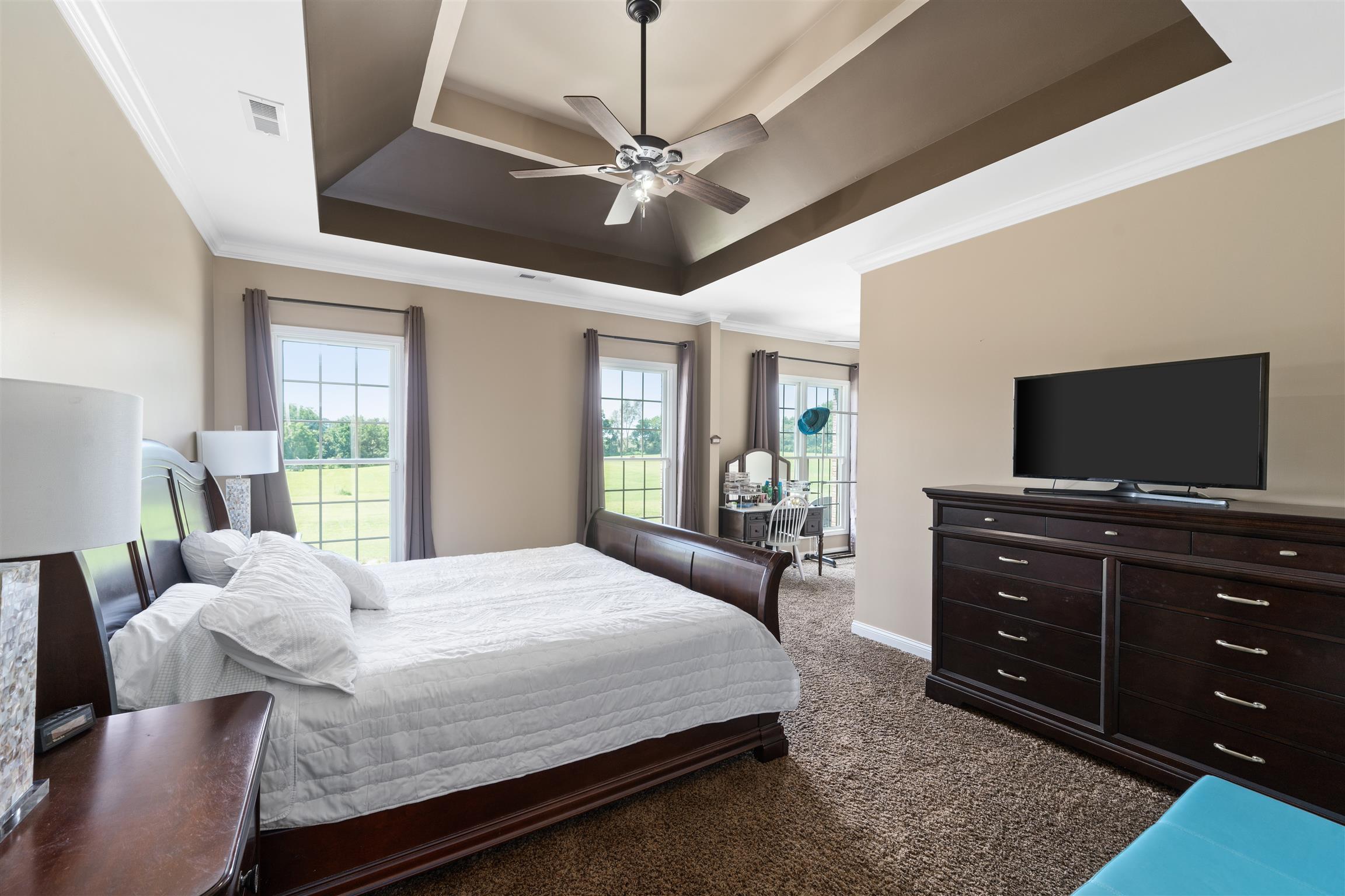 2570 Gunn Road Adams, TN 37010 - Photo 15 of 27 a bedroom with a bed and a flat screen tv