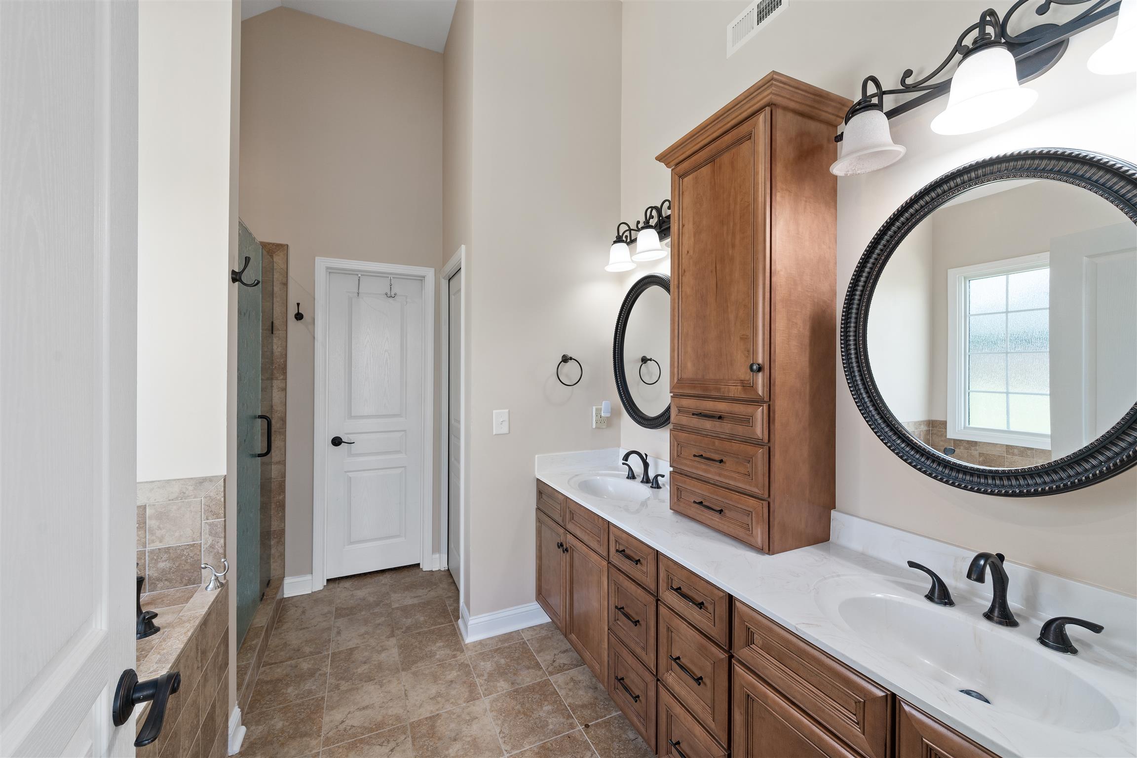 2570 Gunn Road Adams, TN 37010 - Photo 17 of 27 a bathroom with a sink and a mirror