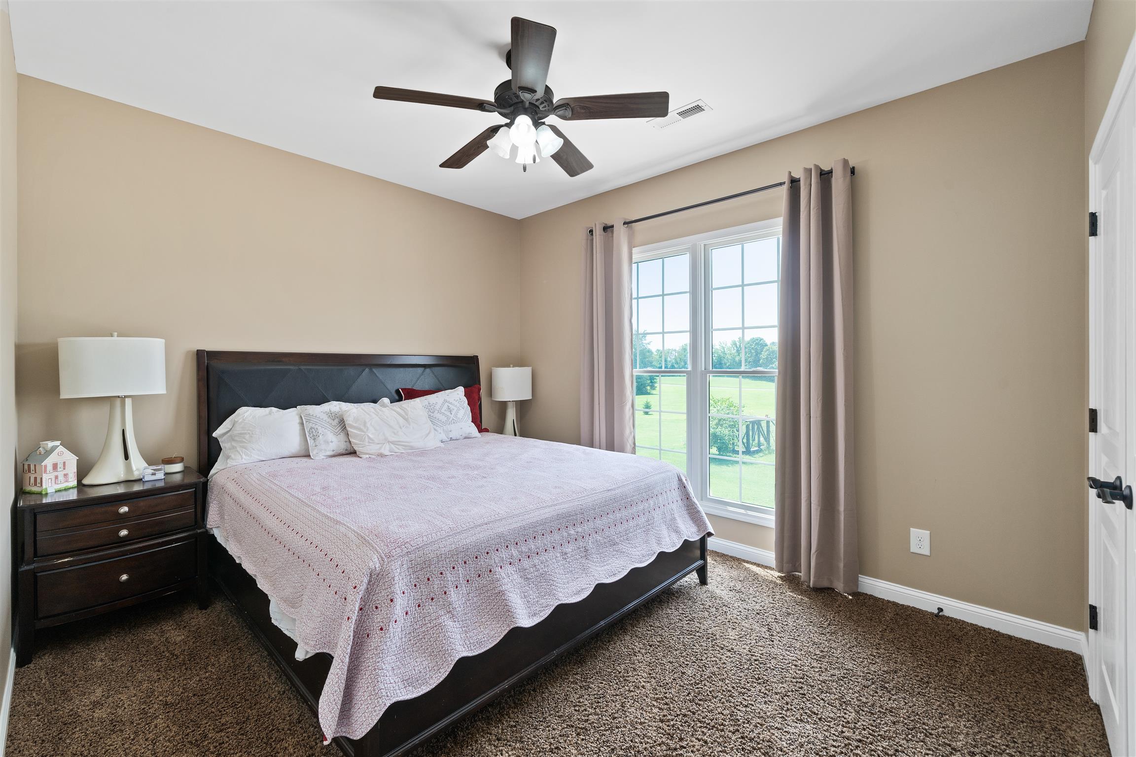 2570 Gunn Road Adams, TN 37010 - Photo 24 of 27 a bedroom with a large bed and a window