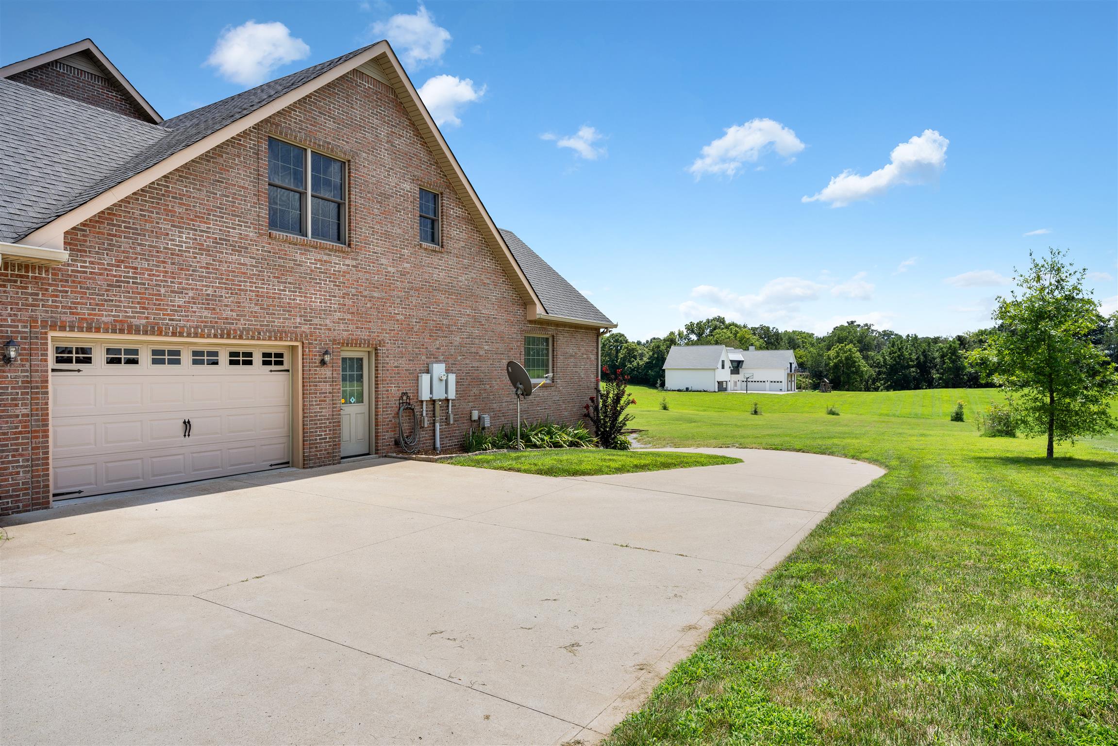 2570 Gunn Road Adams, TN 37010 - Photo 4 of 27 a view of a house with backyard and a garden