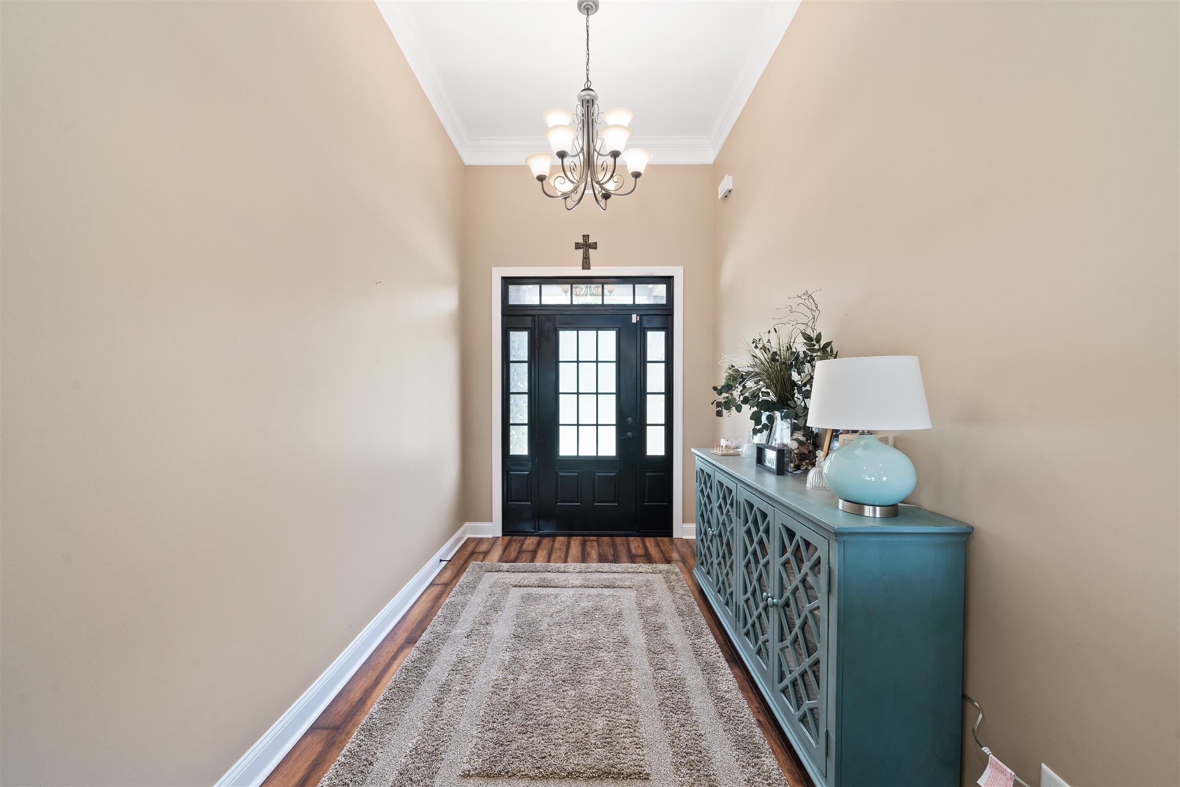 2570 Gunn Road Adams, TN 37010 - Photo 6 of 27 a view of entryway with chandelier