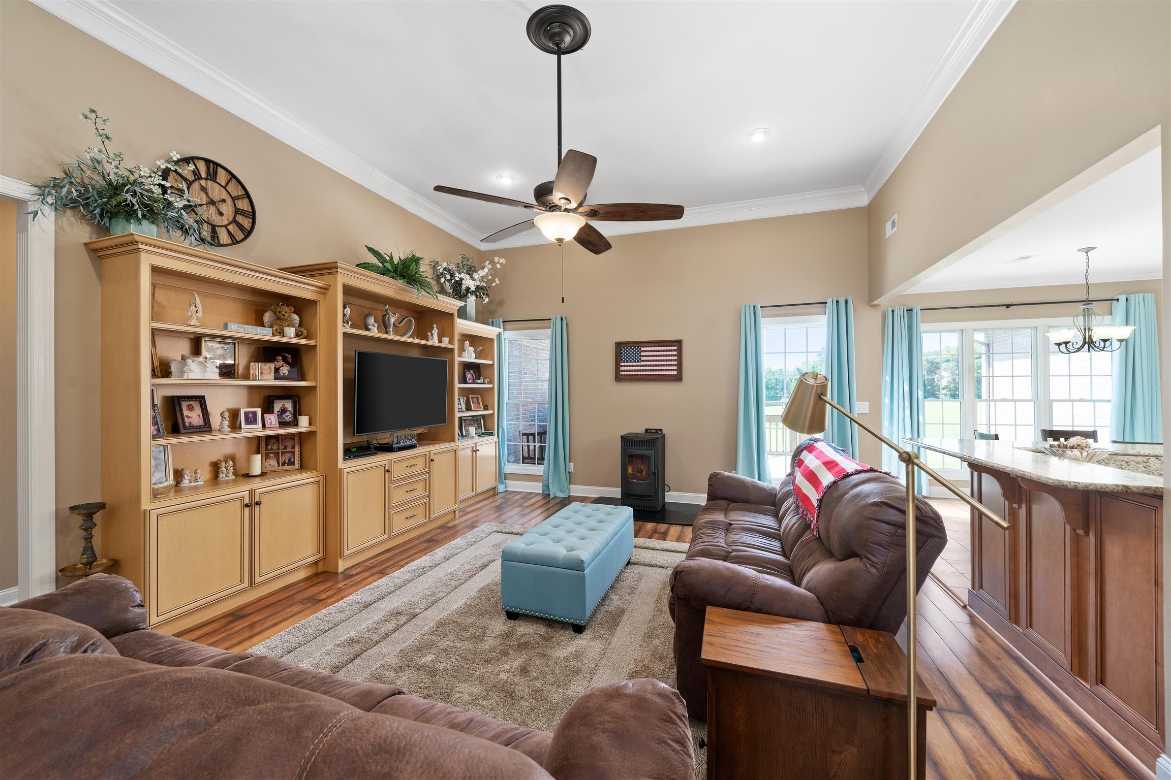 2570 Gunn Road Adams, TN 37010 - Photo 8 of 27 a living room with furniture a ceiling fan and a flat screen tv