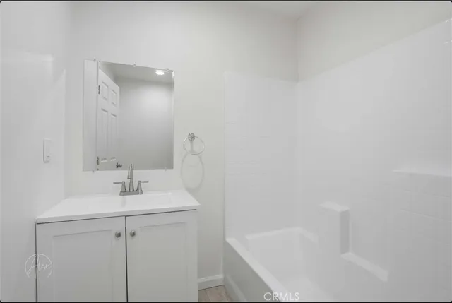 a bathroom with a sink and a bathtub