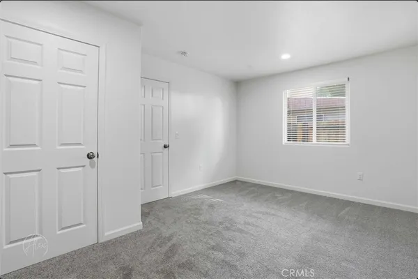 a kitchen with stainless steel appliances granite countertop a sink stove and microwave