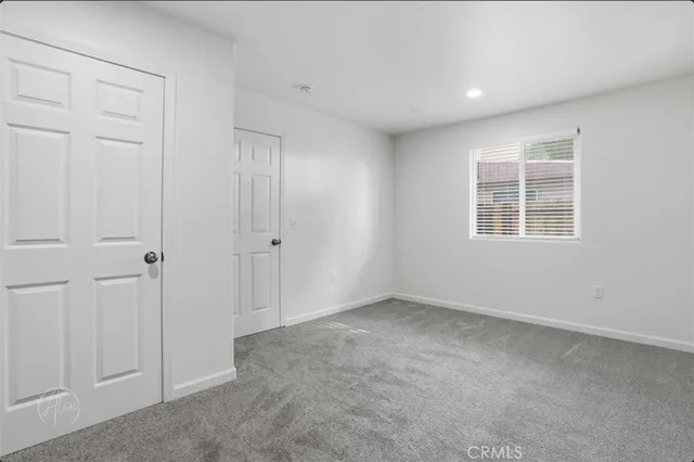a kitchen with stainless steel appliances granite countertop a sink stove and microwave
