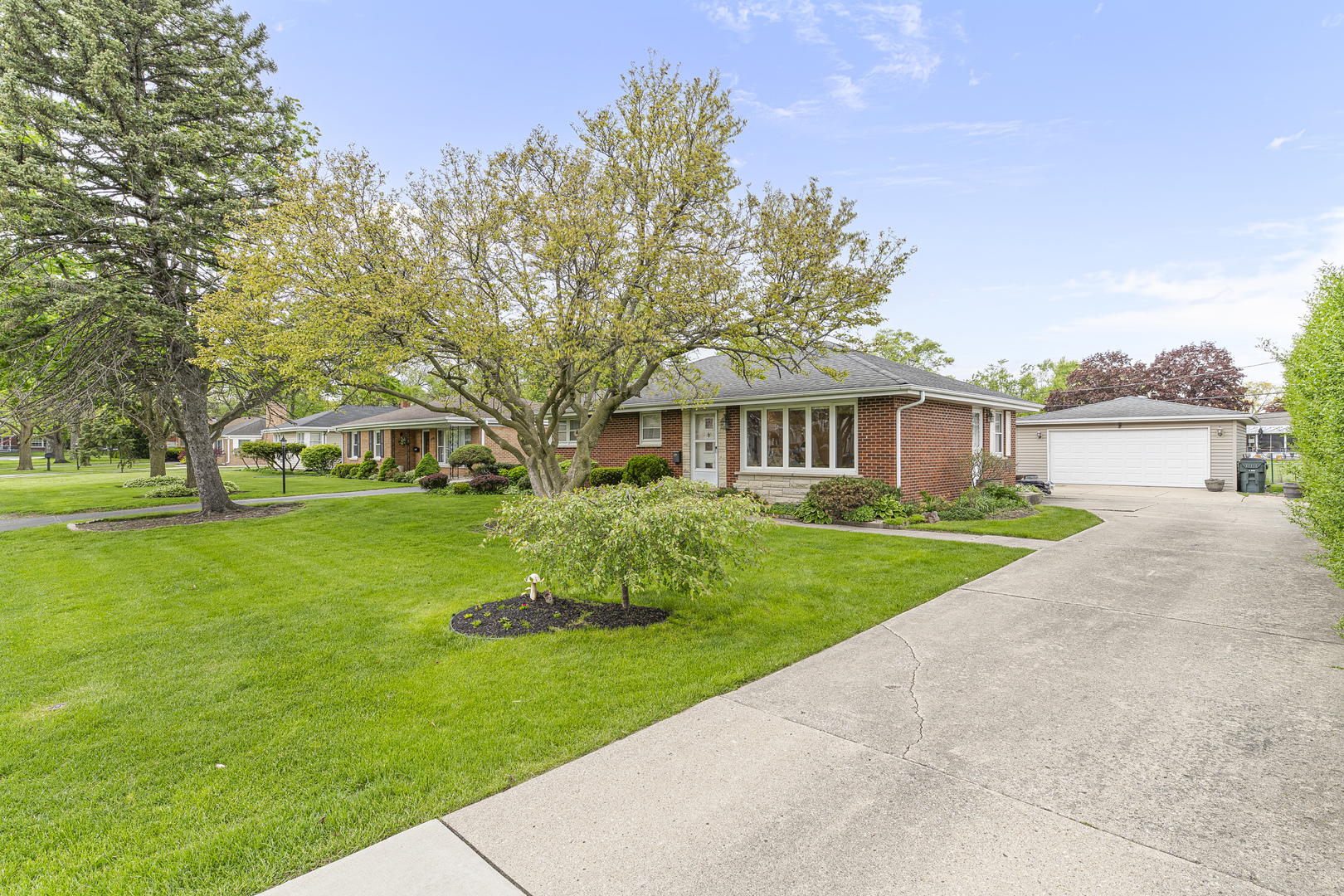 2232 Covert Road Glenview, IL 60025 - Photo 1 of 34 a front view of a house with a garden