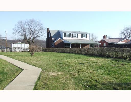 122 Flora Road Baldwin, PA 15227 - Photo 2 of 8 Yard/Garden. 1/3 acre level yard with wrap around concrete driveway