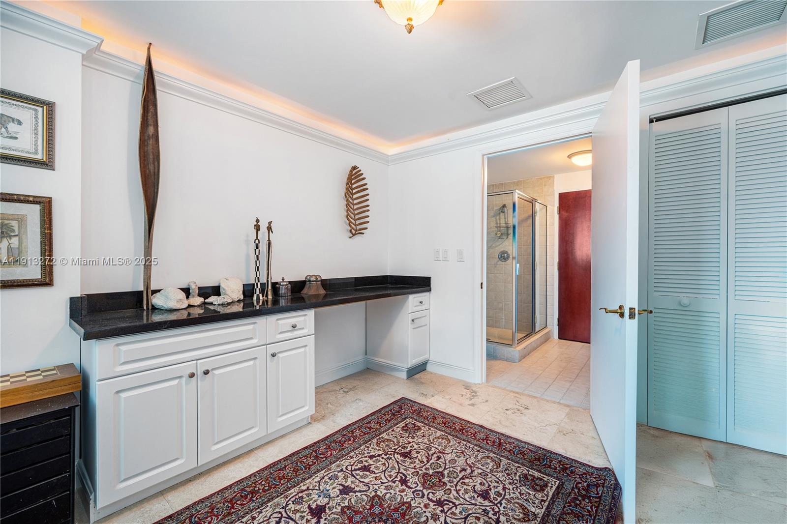 9559 Collins Avenue, Unit S108 Surfside, FL 33154 - Photo 1 of 9 a spacious bathroom with a sink and a mirror
