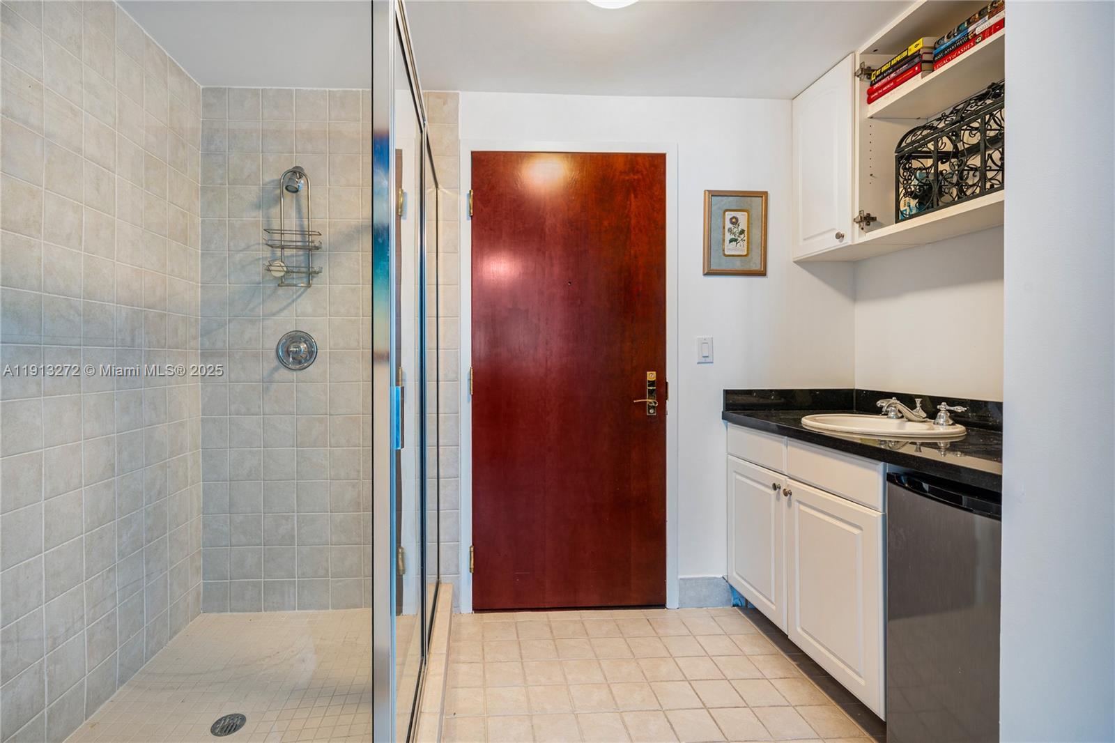 9559 Collins Avenue, Unit S108 Surfside, FL 33154 - Photo 5 of 9 a kitchen with stainless steel appliances granite countertop a refrigerator and a sink