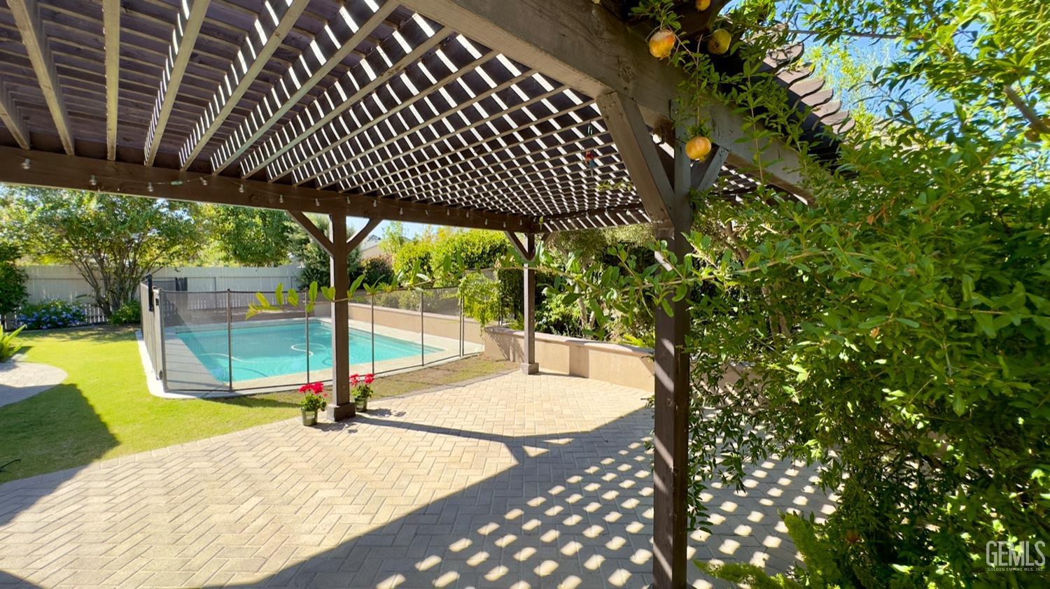 Undisclosed Address Bakersfield, CA 93311 - Photo 21 of 48 a view of a swimming pool with a patio