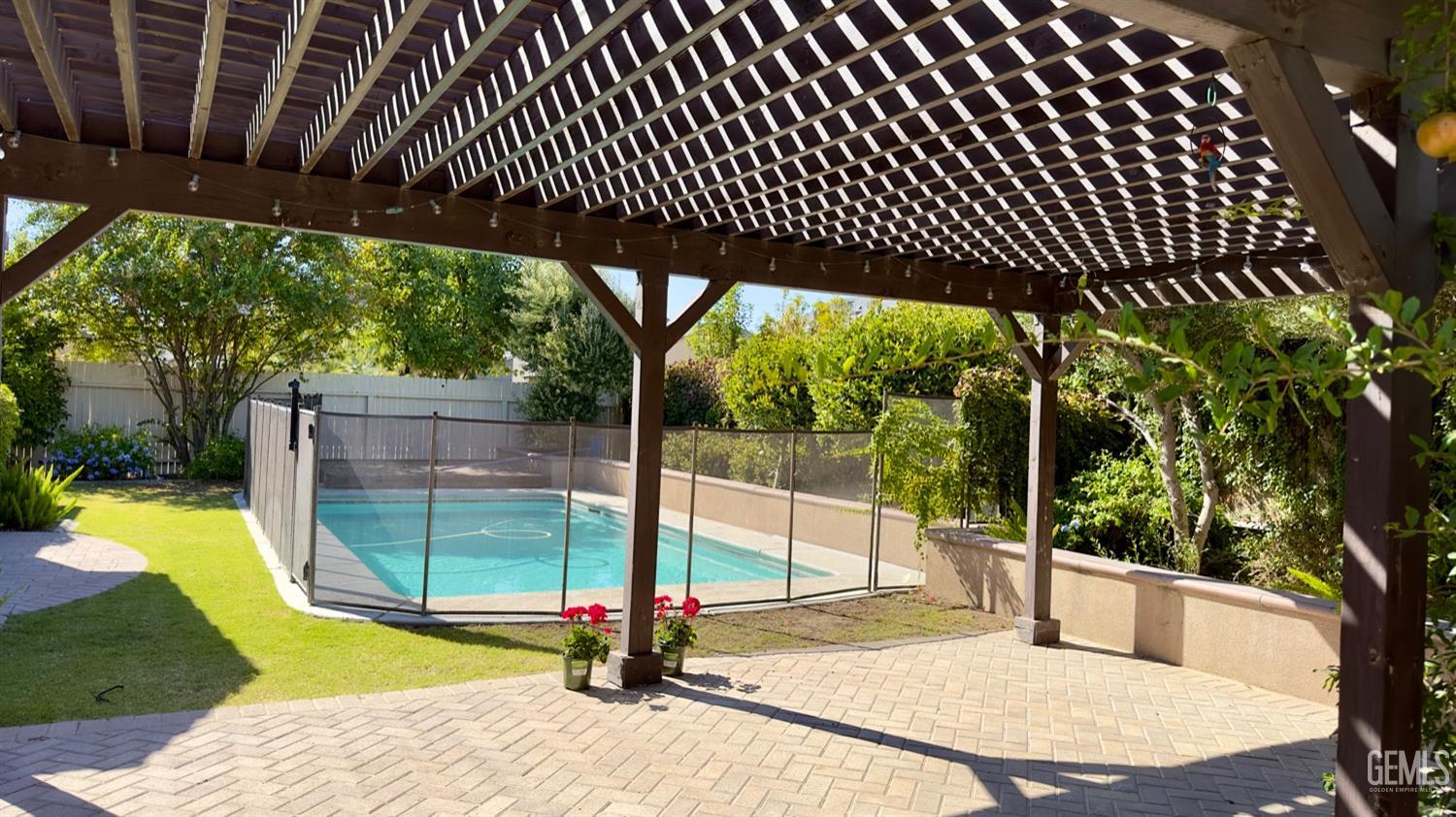 Undisclosed Address Bakersfield, CA 93311 - Photo 23 of 48 a view of a swimming pool with a patio